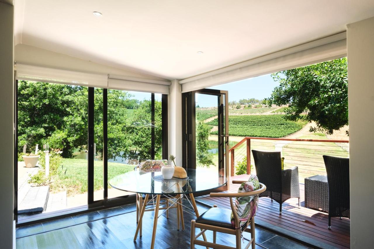 Alluvia Boutique Winery & Luxury Accommodation Stellenbosch Zewnętrze zdjęcie A room with a view of the vineyards